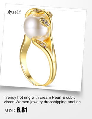 Black and white crystal statement flower ring with a gold-toned band featuring a central cream pearl surrounded by cubic zirconia stones set in an elegant leaf-inspired design.