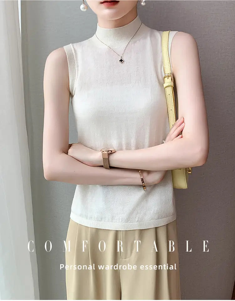 A delicate off-white wool turtleneck sleeveless sweater vest featuring a soft breathable knit texture with ribbed detailing along the neckline and hem.