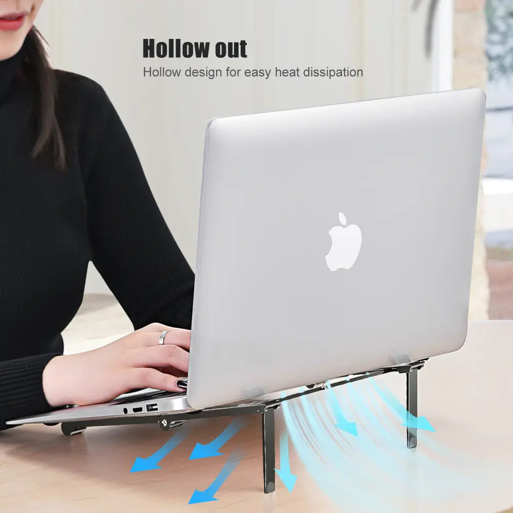 Silver foldable aluminum laptop stand with hollow design for heat dissipation featuring sleek metal legs and a minimalist aesthetic for mobile phone and mobile phone tablet use.