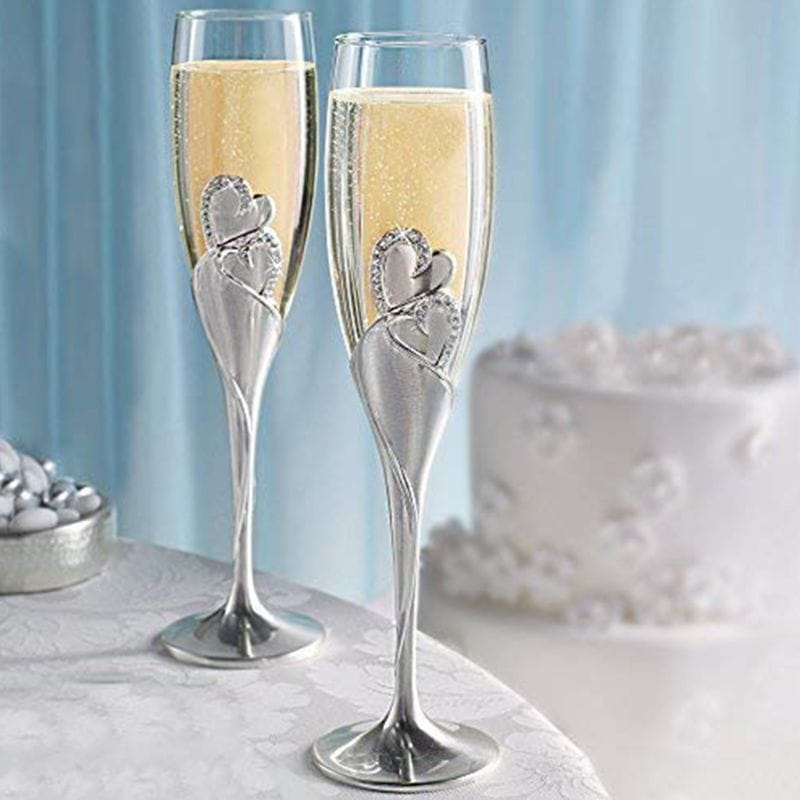 Silver wedding champagne flutes featuring intertwined gold heart designs with sparkling embellishments perfect for toasting glasses set