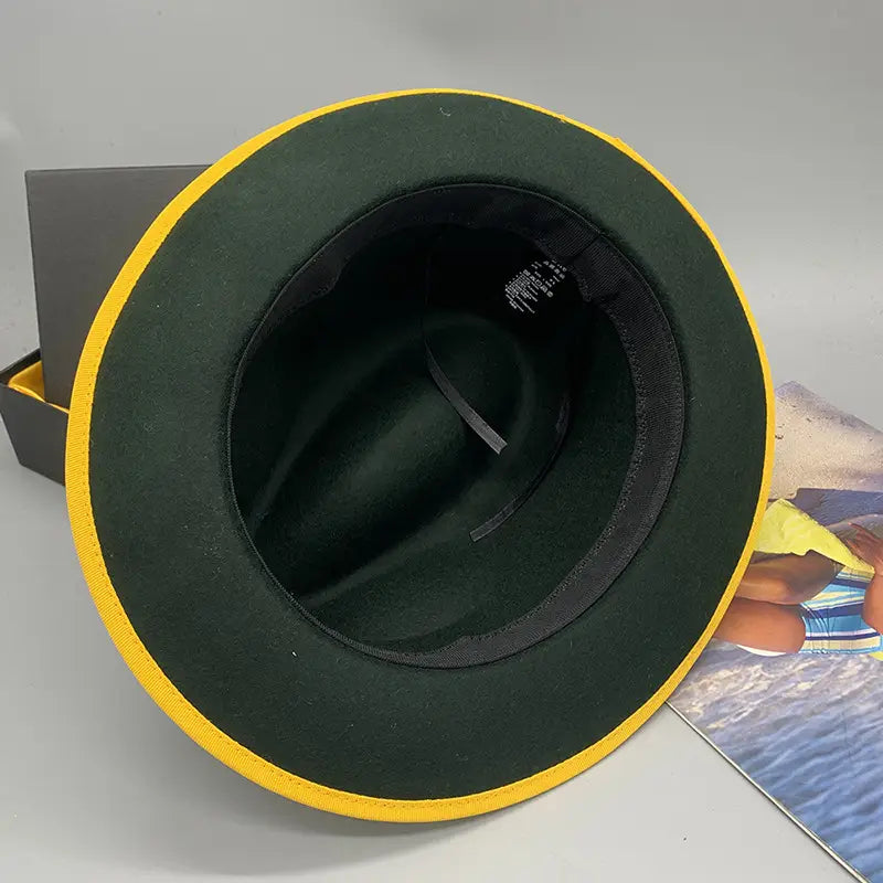 dark green woolen felt fedora hat with bright yellow trim and feather accent designed for unisex use.