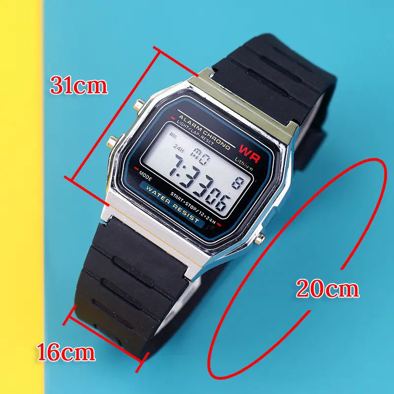 Black rubber strap digital led sport watch with silver-toned rectangular case and unisex wristwatch model number 31cm by 20cm displaying time.