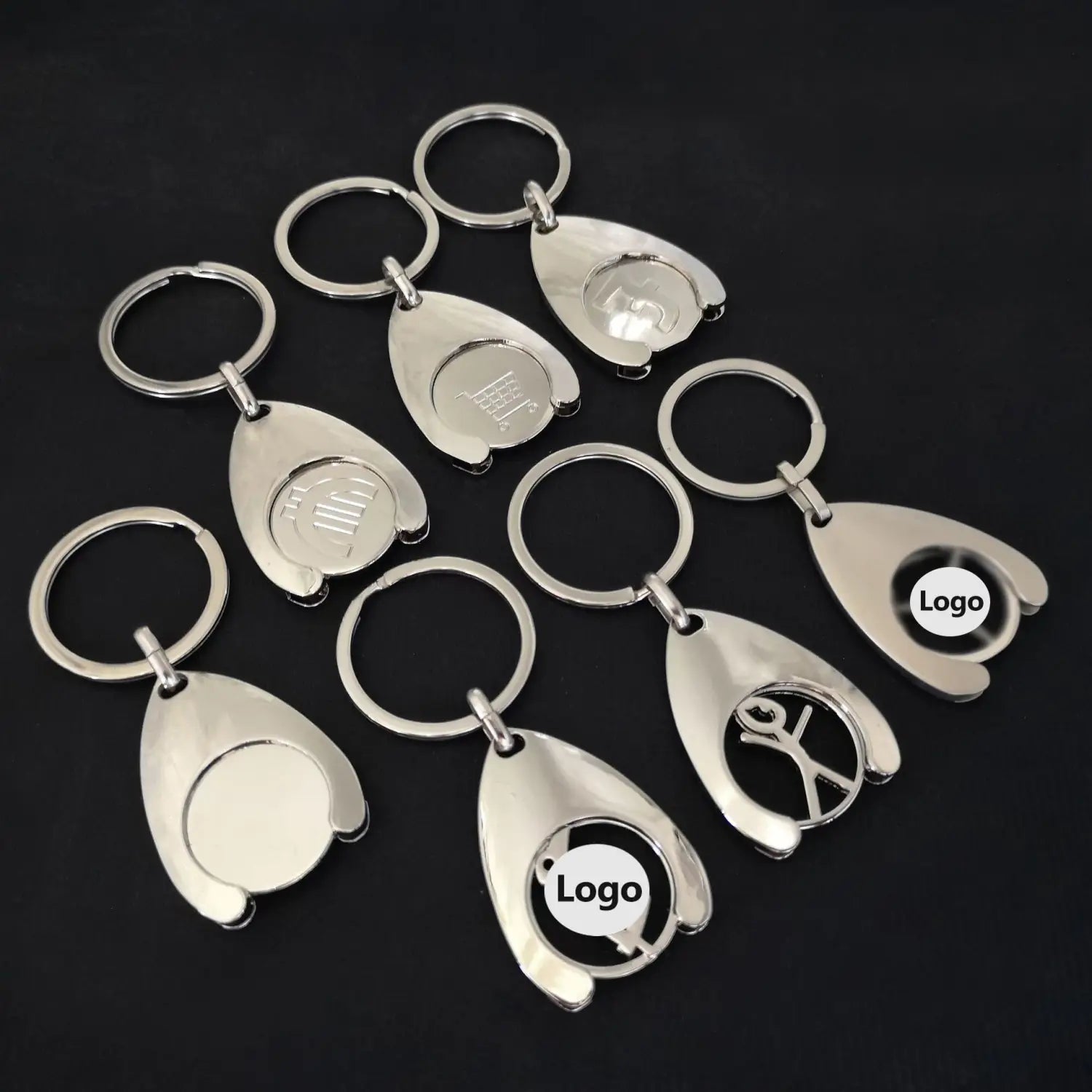 silver metallic custom engraved metal keychains with teardrop-shaped design and engraved or cut-out logo areas