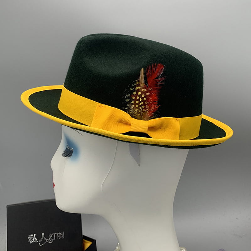 Black woolen felt fedora hat with a bright yellow ribbon bow and a red and white feather accent for unisex use.