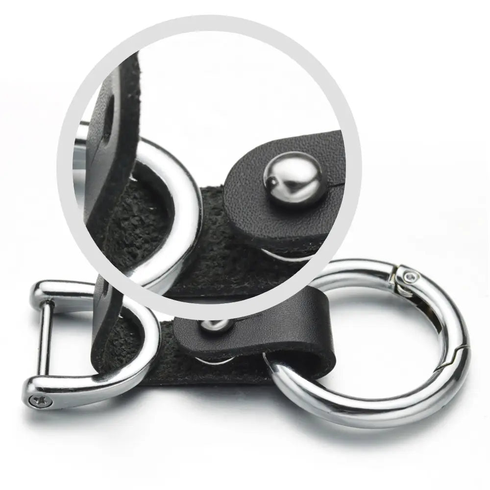 Black leather car keychain with silver-toned metal hardware and d-ring clasp.