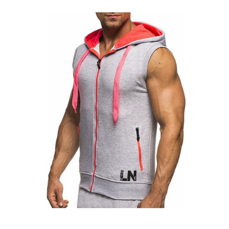 Men sleeveless zip hoodie gym tank top in gray with bright pink interior lining and matching drawstrings featuring an orange zipper pull on the front.
