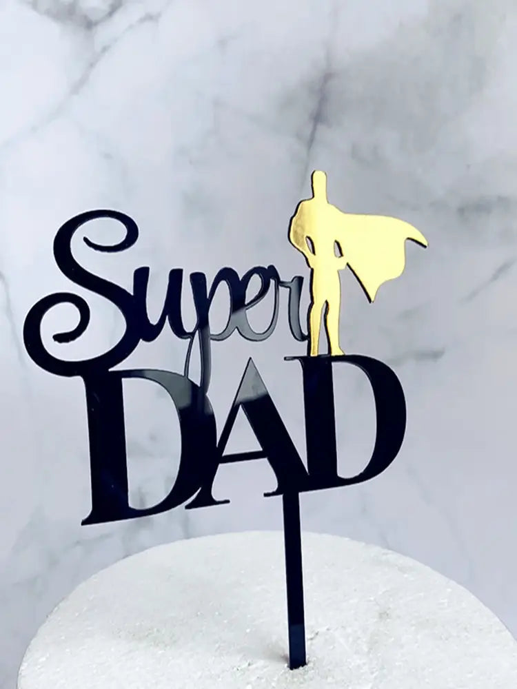 Black and gold acrylic Father’s Day super dad cake topper featuring a superhero silhouette.