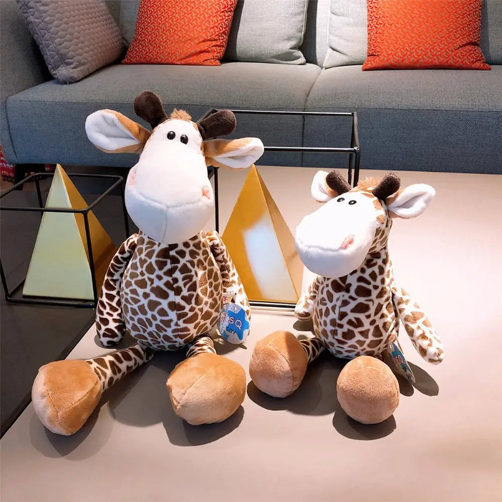 two plush toy safari animal stuffed doll giraffes with brown and cream spotted plush filling soft fabric bodies white faces black button eyes and tan hooves measuring 25cm
