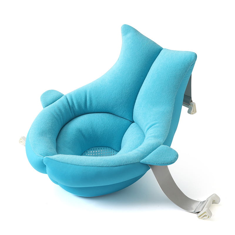 a plush light blue dolphin shaped foldable newborn bath mat and cushion with a soft fabric exterior and adjustable gray straps for baby bath support