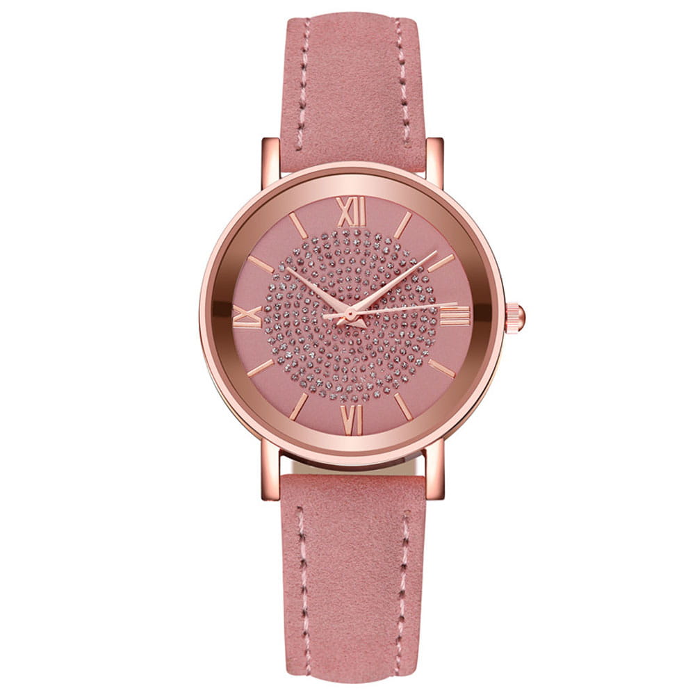 Rose gold crystal quartz women watch with a pink leather strap and a face adorned with sparkling rhinestones.