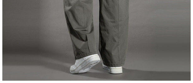 men cargo pants cotton relaxed fit utility trousers in gray paired with white sneakers