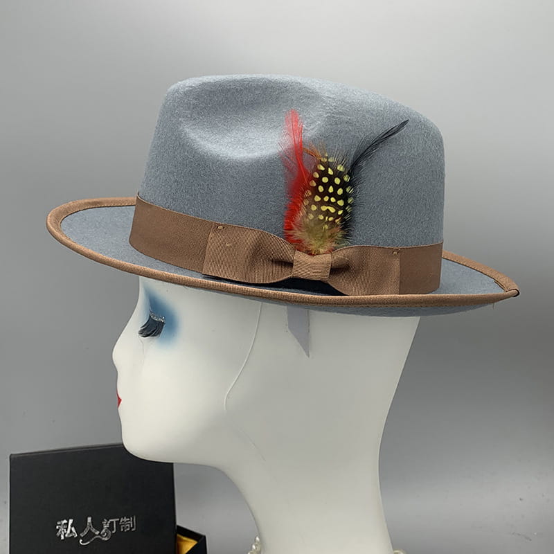 Light gray woolen felt unisex fedora hat with brown ribbon bow and decorative feather accent.