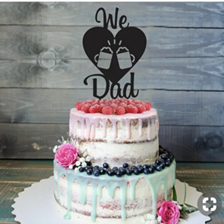 a two-tiered cake with a pink and mint drip glaze adorned with fresh berries and flowers featuring a fathers day acrylic cake topper super dad