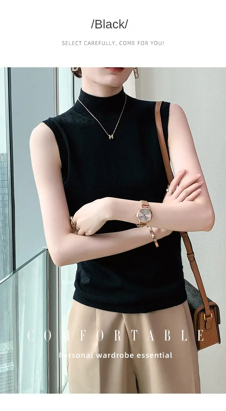 Black sleeveless turtleneck wool sweater vest made of soft knit fabric shown from the back.