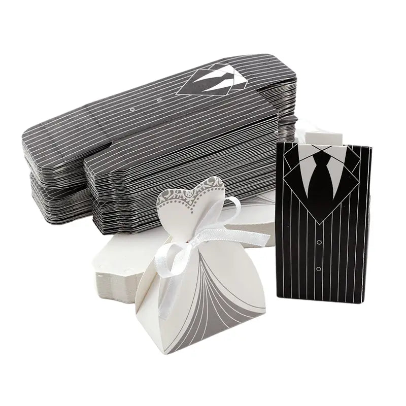Black and white striped paper wedding favor candy boxes designed to resemble bride and groom tuxedos and dresses in a 30-piece set.