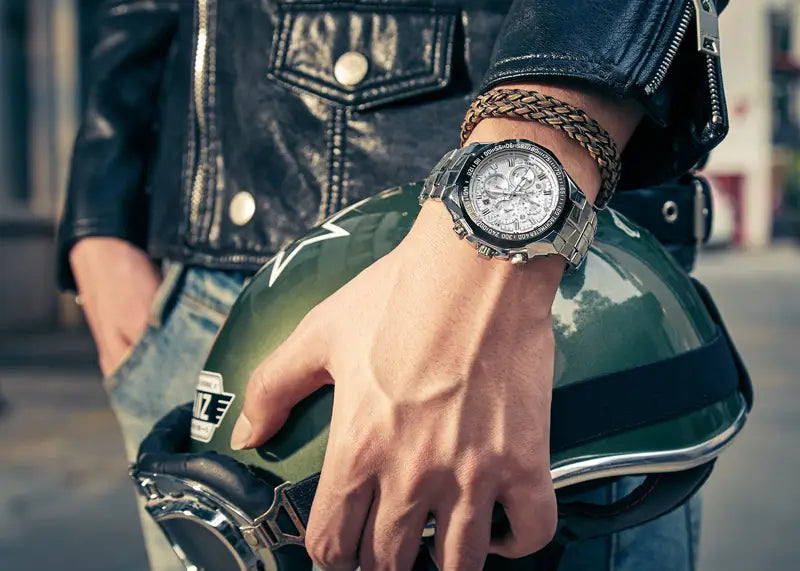 Silver-toned gold chronograph watch for men with a textured stainless steel case and bracelet featuring multiple subdials on a white dial.