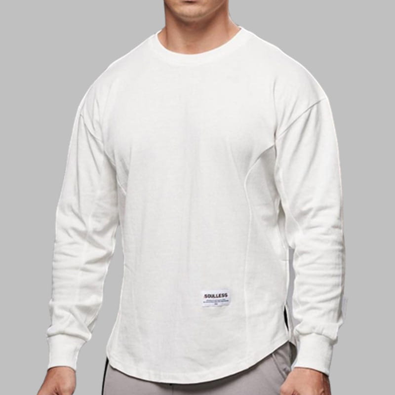 White long-sleeved cotton t shirt for men with crewneck, subtle seam detailing, curved hem, and a small brand label at the lower front.