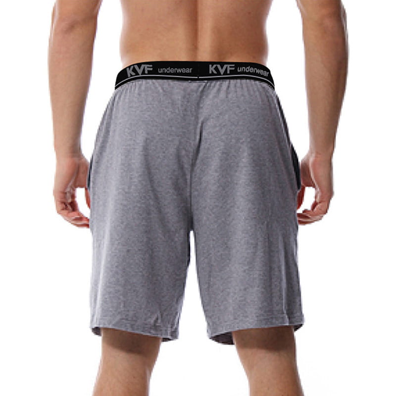Men cotton boxer shorts in gray heathered fabric with a black elastic waistband featuring white kvf underwear branding designed for loose casual lounge and gym jogging use.