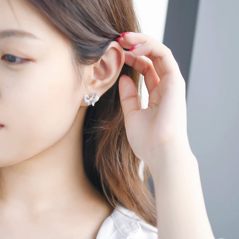 Silver butterfly stud earring with delicate detailing and subtle sparkle from the silver bowknot zircon necklace and earrings set.