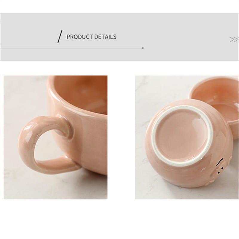 A blush pink ceramic mug from the cute pig ceramic dinnerware set with a glossy finish and a minimalist face design on the bottom.
