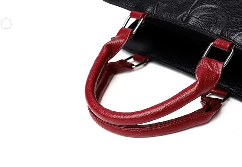 black crossbody handbag style1 style2 featuring a red leather handle with silver-toned metal hardware attached to textured pu leather satchel style1 style2 style1