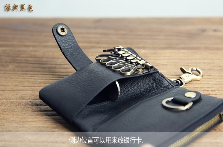 Black leather key chain wallet for men featuring brass-colored metal hooks and a sturdy clasp for organized key storage.