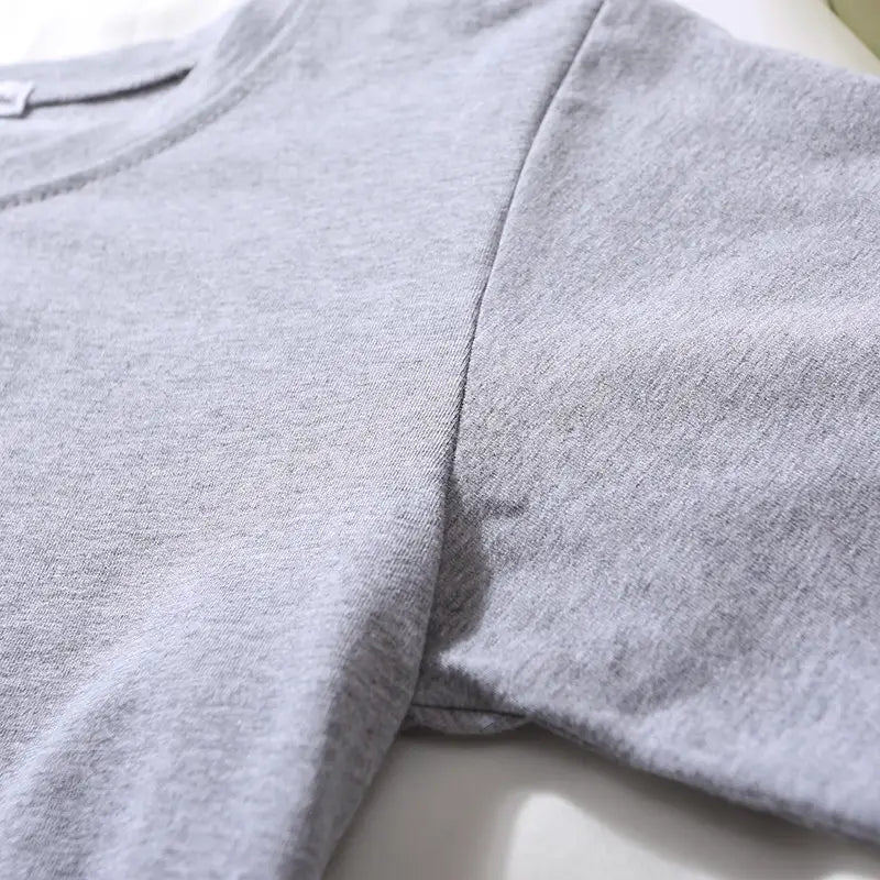 Women solid short sleeve crop top casual t-shirt in soft heather gray cotton with a simple crew neckline and subtle seam detailing.