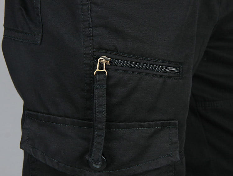 Men tactical cargo pants in black cotton featuring a gold-toned zipper with matching fabric pull tab suitable for work and outdoor use.