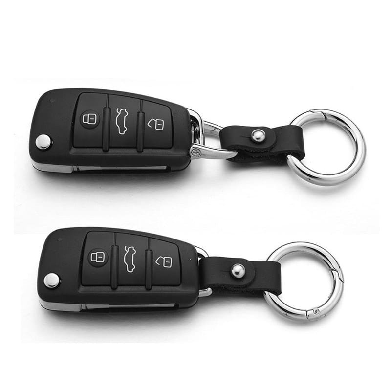 Black leather car keychain with silver hardware featuring a black Audi car key fob with silver buttons and an attached leather strap on a metallic ring.