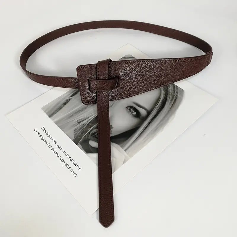 Brown textured wide pu leather women’s waist belt with a simple rectangular buckle and matching strap.