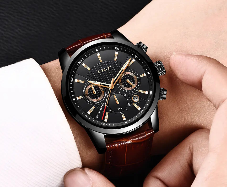 Lige men’s leather chronograph quartz watch featuring a black dial with gold-tone hands and subdials on a brown leather strap.