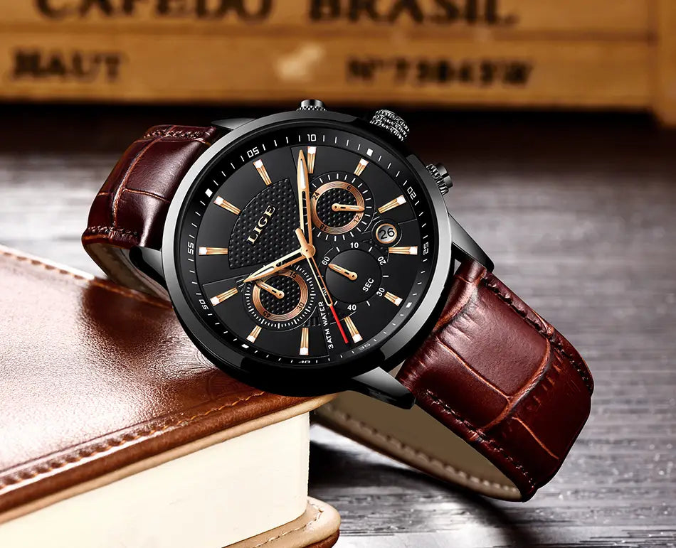 Lige men’s leather chronograph quartz watch featuring a black dial with gold-tone accents and a brown leather strap.