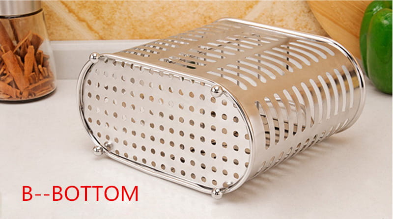 Silver stainless steel oval-shaped vegetable strainer with a perforated design and rounded edges from the stainless steel cutlery and utensil storage rack collection.