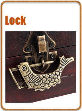 antique brass fish-shaped decorative lock with intricate scales and sliding bar mechanism alongside a zinc alloy corner protector 4-pack bronze floral edge cover.
