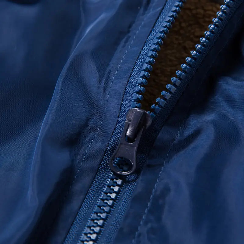 mens hooded jacket asia size featuring a dark blue nylon zipper with metallic pull tab and contrasting tan fleece lining in a lightweight floral windbreaker design