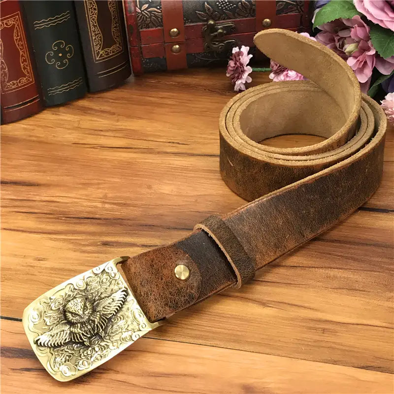 brown leather men jeans belt featuring a detailed brass owl buckle made of genuine leather