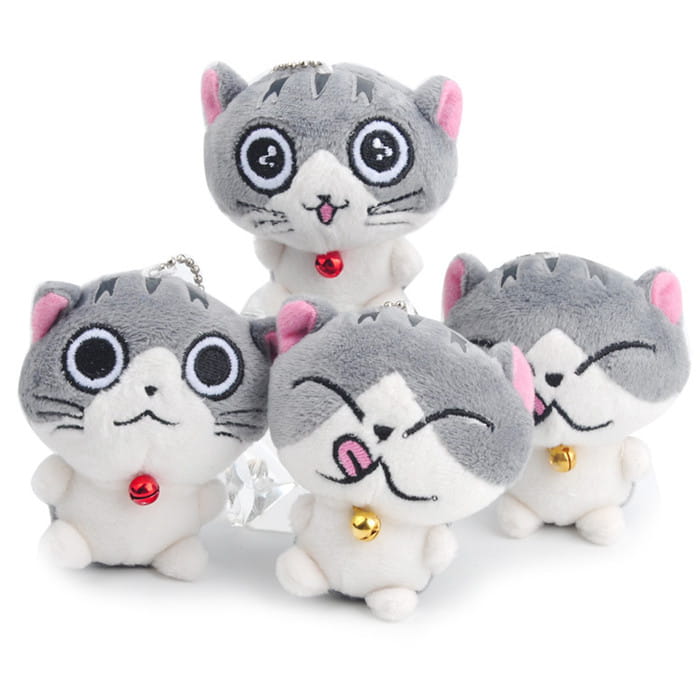 Plush cat keychain featuring a cute gray and white kitten design with pink inner ears, black outlined eyes, and small red or gold bells around the neck as a bag charm toy.