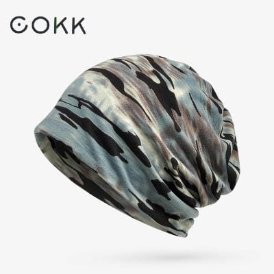A soft, stretchy floral knit beanie hat for unisex casual autumn headwear featuring a flowing gray and black camouflage pattern.