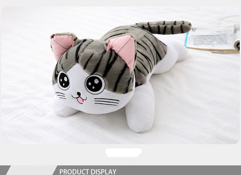 a plush gray and white tabby cheese cat soft animal doll with pink inner ears, black stripes, large round eyes, a small pink tongue sticking out, and embroidered whiskers
