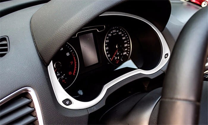 Audi Q3 2012-2016 interior trim decoration set featuring a silver-trimmed dashboard with a black instrument cluster, red needle gauges, and a central digital display.