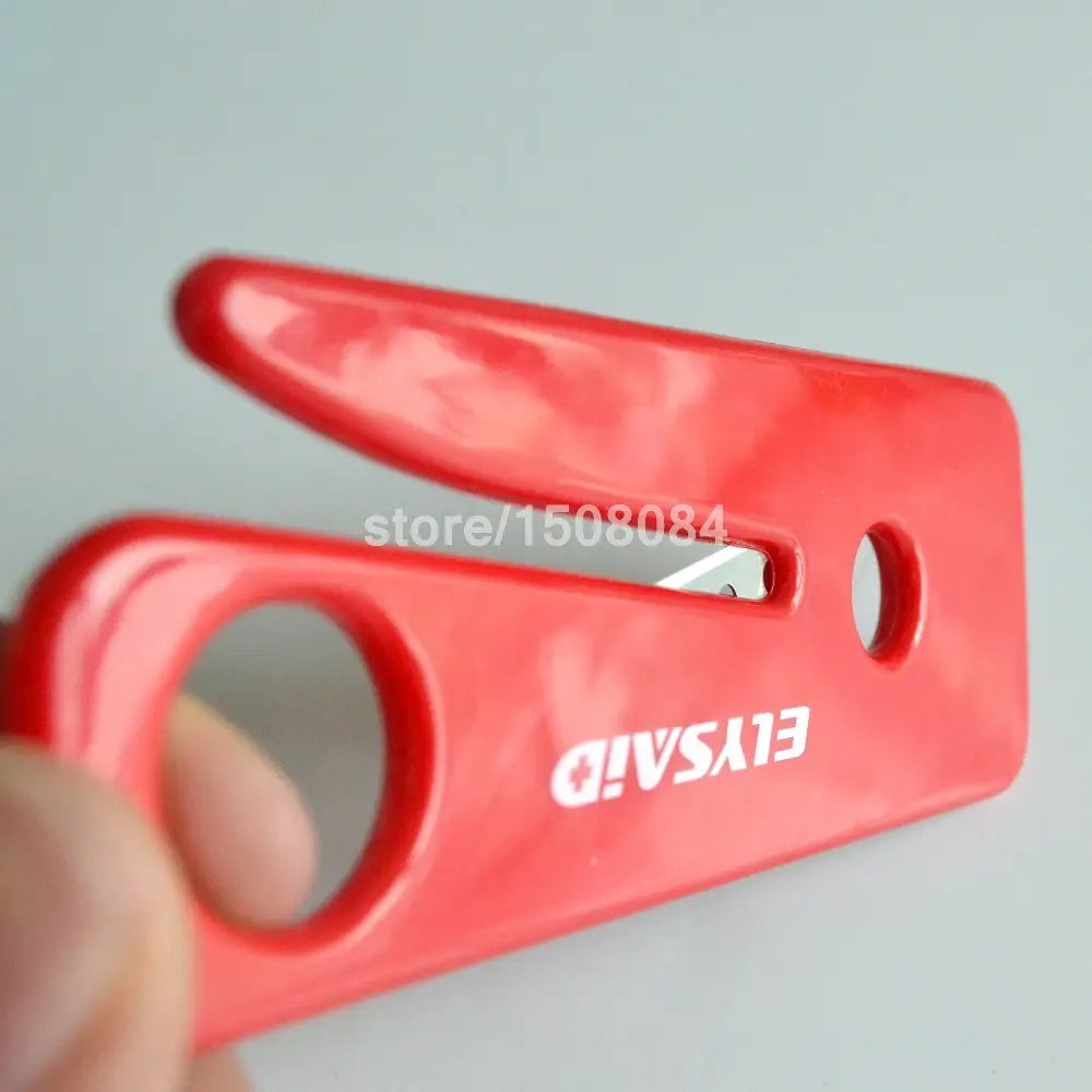 Red plastic elysaid seat belt cutter with a built-in blade and two circular handles designed for emergency car window breaking in a 5-piece set.