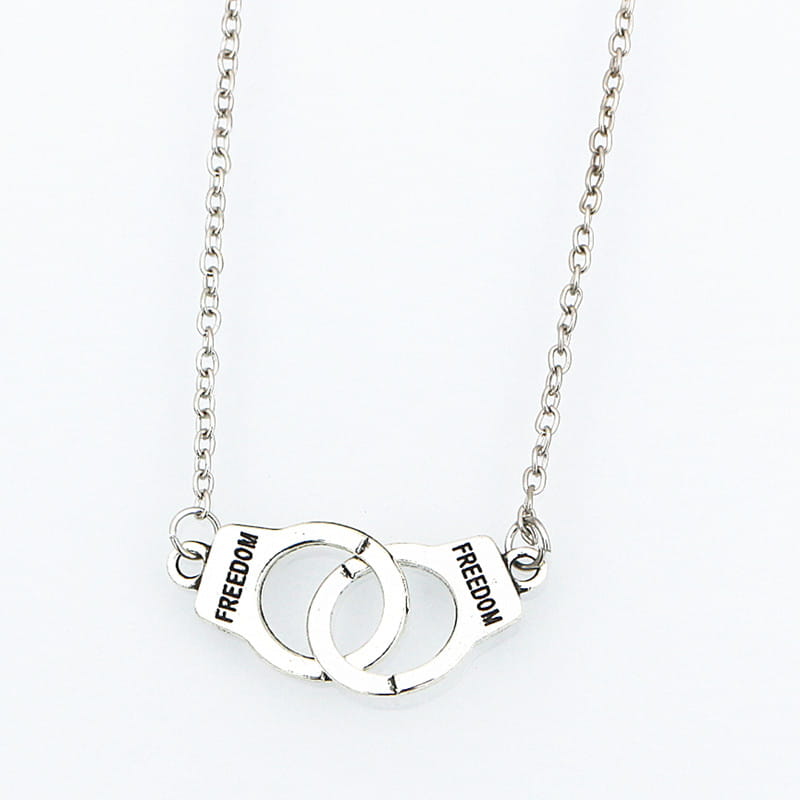 silver handcuff-shaped necklace with freedom engraved on each pad crafted as fashion jewelry necklace.
