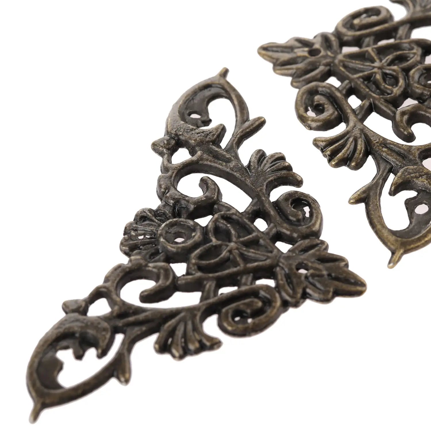 Antique bronze-colored zinc alloy corner protector with intricate floral and scrollwork design for edge protection in a 4-pack.