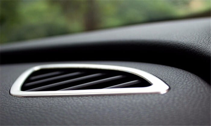 Silver-trimmed air vent with a sleek angular design set into the black dashboard of the Audi Q3 2012-2016 interior trim decoration set.