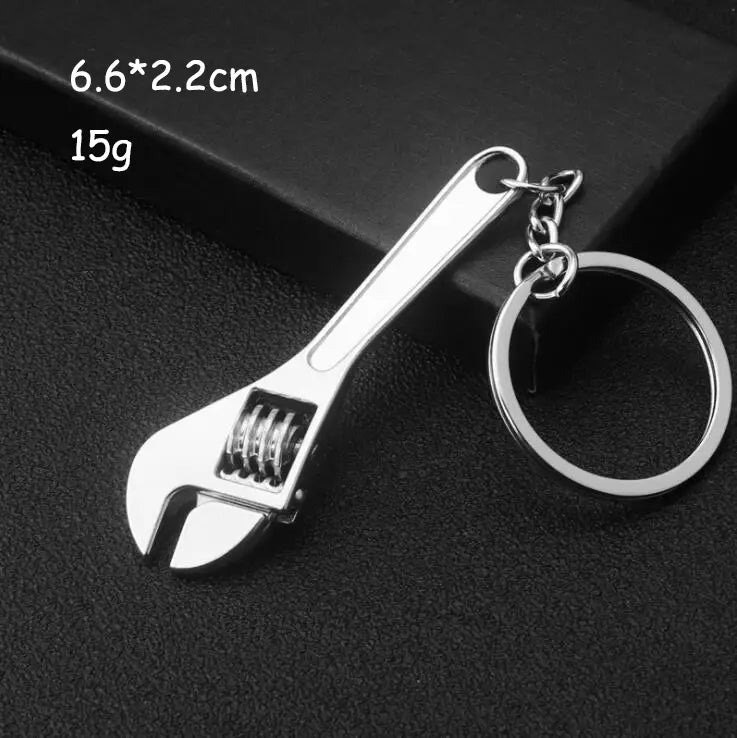 Silver adjustable wrench keychain with polished metallic finish and detailed spring mechanism from a mini tool keychain set metal multi-tool key ring.