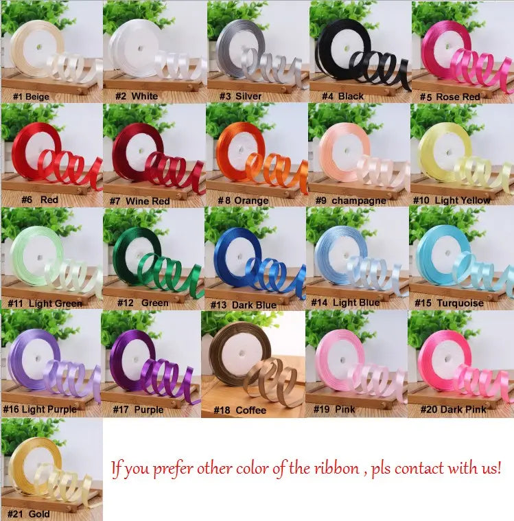 A collection of 21 colorful satin ribbons on spools with color names displayed for custom wedding hand fans personalized bamboo silk favors.