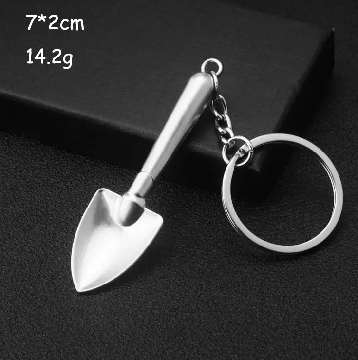 A sleek metallic miniature garden trowel keychain from the mini tool keychain set made of polished silver metal with a sturdy ring attachment.
