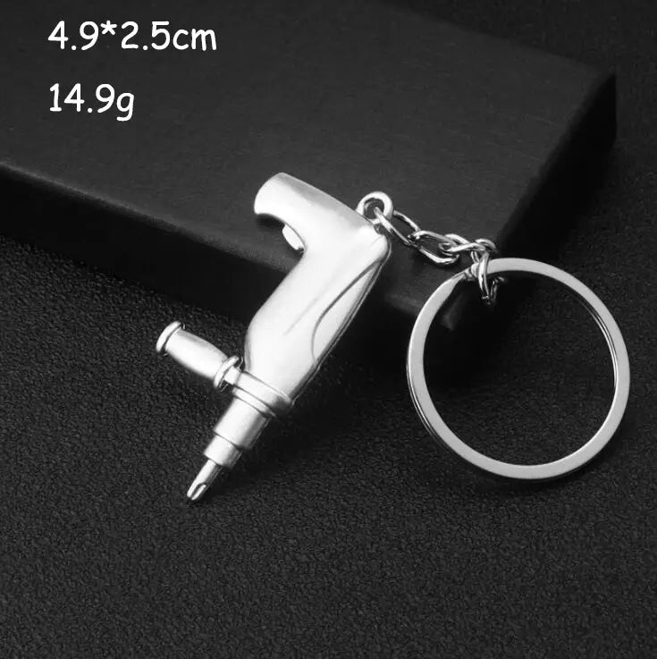 Silver-colored metal mini tool keychain shaped like a miniature air hammer with chain and ring attachment from the mini tool keychain set metal multi-tool key ring.