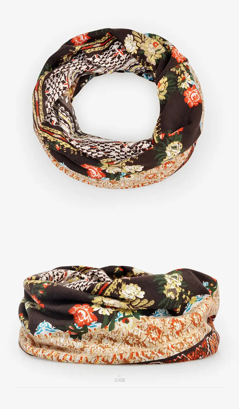 A stylish multi-patterned infinity scarf in rich earthy tones with floral motifs paired with a floral knit beanie hat unisex casual autumn headwear.
