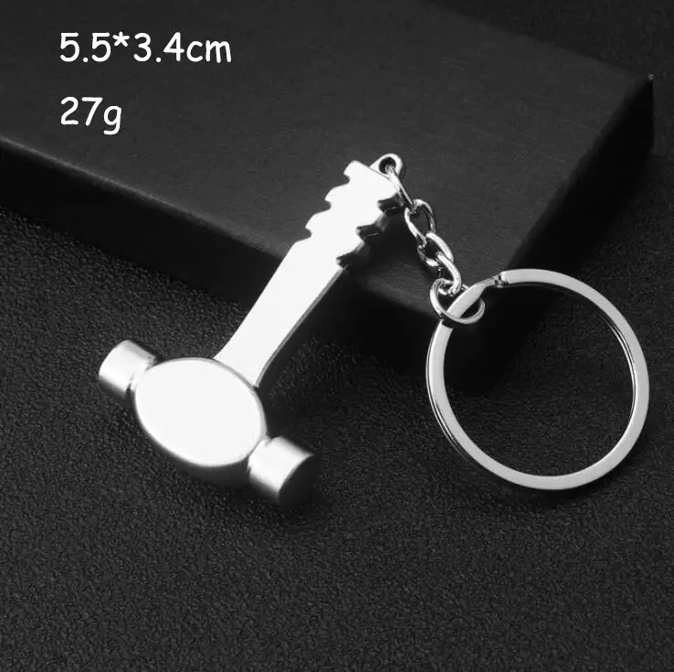 Silver-colored metal hammer-shaped keychain with a polished finish and attached chain from the mini tool keychain set metal multi-tool key ring.